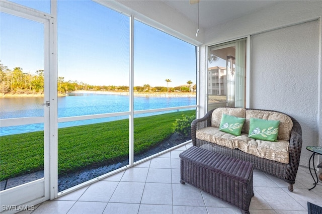 sunroom / solarium with a water view