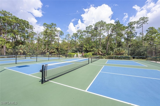 view of sport court with community basketball court and fence