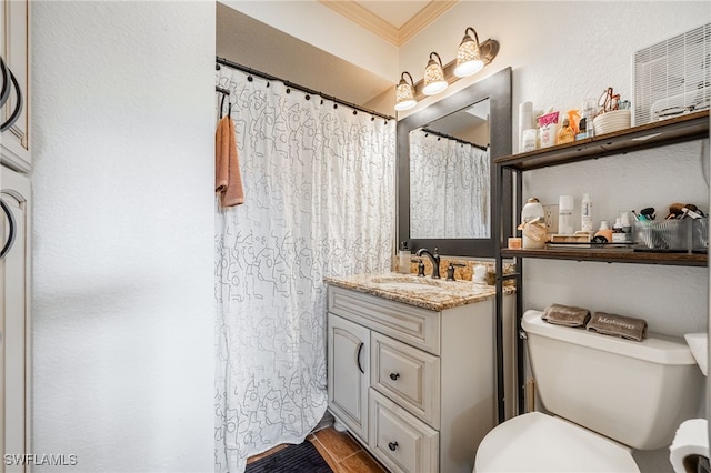 full bathroom featuring ornamental molding, curtained shower, vanity, and toilet