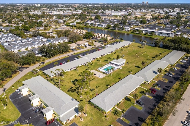 birds eye view of property featuring a residential view and a water view