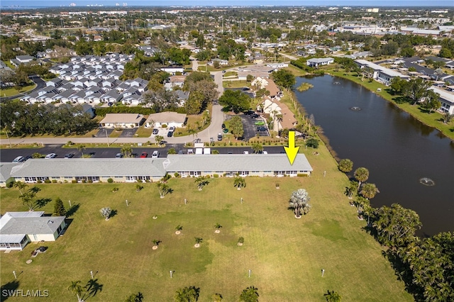 birds eye view of property featuring a water view and a residential view