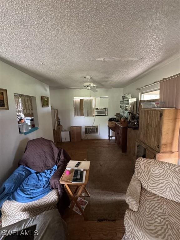 living room featuring lofted ceiling, ceiling fan, a textured ceiling, carpet floors, and an AC wall unit