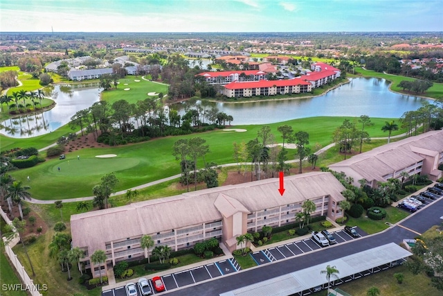 aerial view featuring view of golf course and a water view