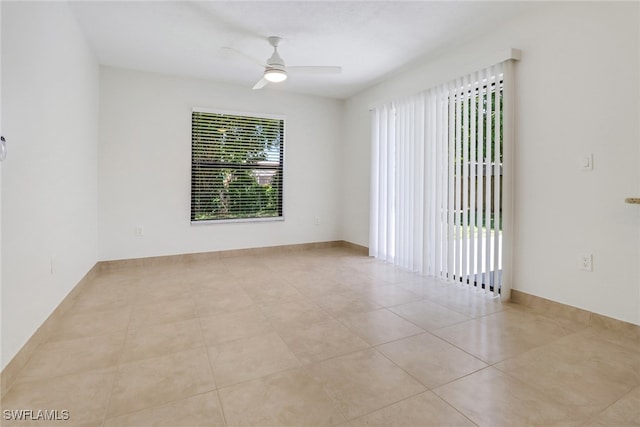 unfurnished room featuring tile patterned flooring and ceiling fan