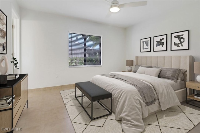 bedroom featuring light tile patterned floors and ceiling fan