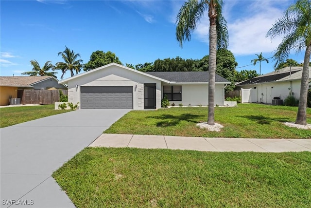 ranch-style house featuring a garage, concrete driveway, a front yard, and fence