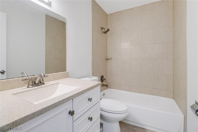 full bath with shower / bath combination, tile patterned flooring, vanity, and toilet