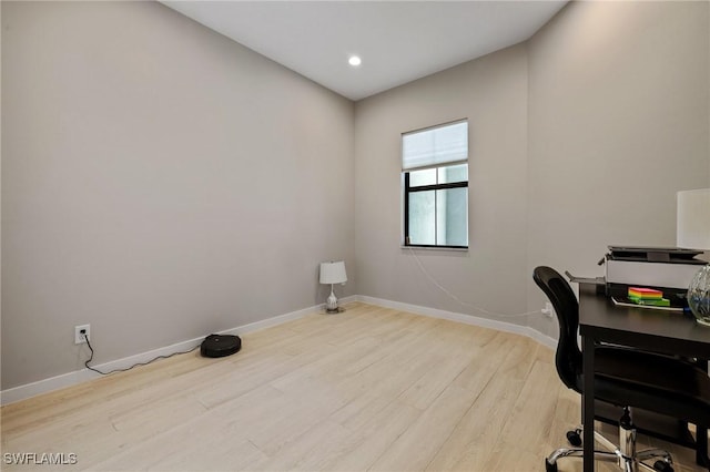 office space featuring recessed lighting, light wood-type flooring, and baseboards