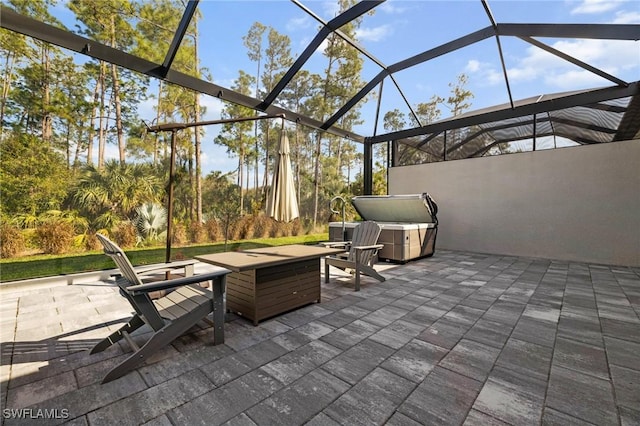 view of patio with glass enclosure