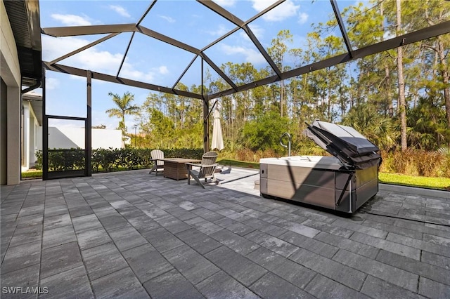 view of patio / terrace featuring a lanai