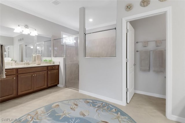 full bathroom with tile patterned flooring, a shower stall, crown molding, baseboards, and vanity