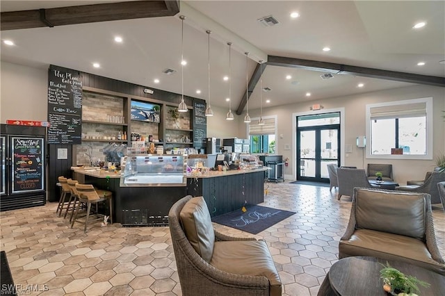 interior space with decorative light fixtures, french doors, visible vents, and vaulted ceiling with beams