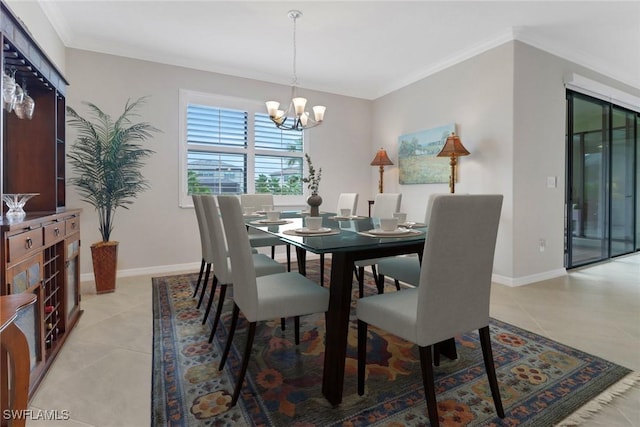 dining space featuring light tile patterned floors, a notable chandelier, baseboards, and ornamental molding