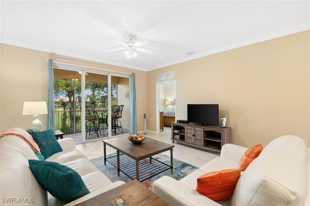 living room featuring a ceiling fan, visible vents, crown molding, and light tile patterned floors