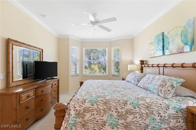 bedroom with baseboards, a ceiling fan, crown molding, and light colored carpet