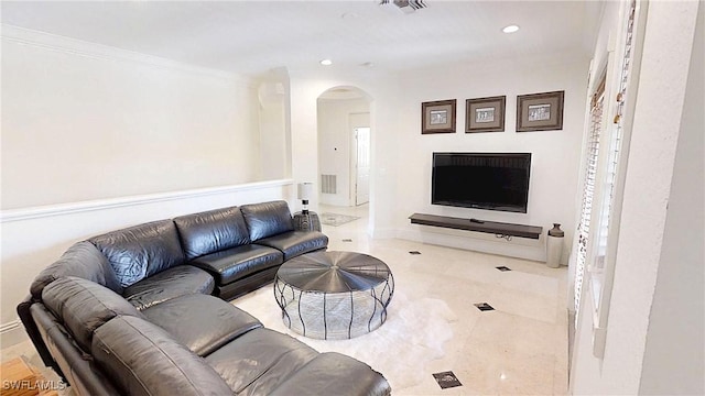 living area featuring recessed lighting, visible vents, arched walkways, and crown molding