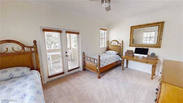 bedroom featuring access to exterior, light carpet, crown molding, and ceiling fan