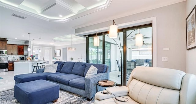 living area featuring visible vents, coffered ceiling, a ceiling fan, crown molding, and beam ceiling