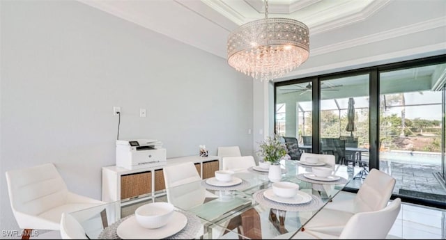 dining space featuring a tray ceiling, crown molding, and ceiling fan with notable chandelier