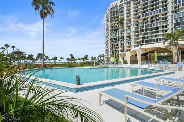 community pool with a patio area