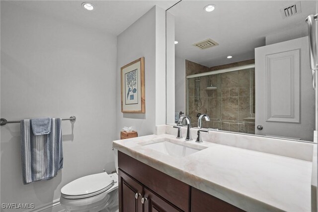 full bath featuring a stall shower, visible vents, vanity, and toilet