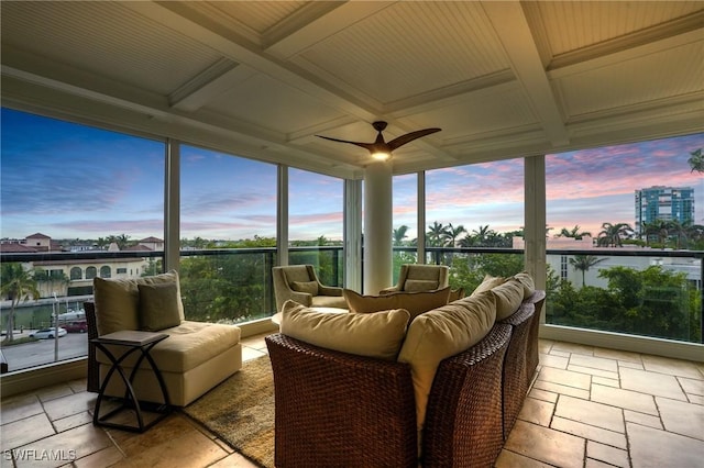 sunroom with a ceiling fan, beam ceiling, and coffered ceiling