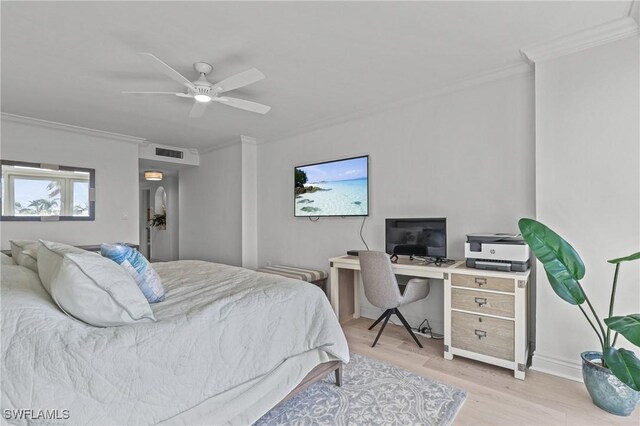 bedroom featuring light wood finished floors, visible vents, ornamental molding, and ceiling fan