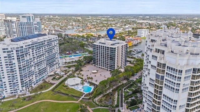 drone / aerial view featuring a view of city and a water view