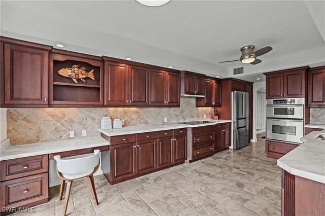 kitchen featuring visible vents, decorative backsplash, a ceiling fan, appliances with stainless steel finishes, and light countertops