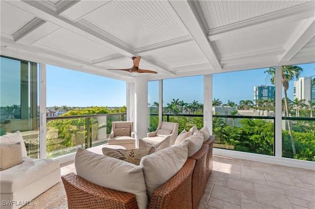 sunroom with beamed ceiling, ceiling fan, coffered ceiling, and outdoor lounge area