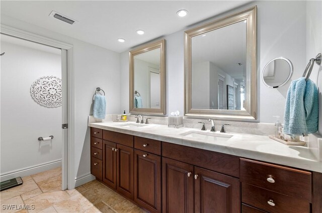 full bathroom with double vanity, visible vents, recessed lighting, and a sink