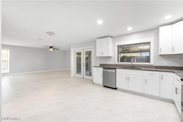 kitchen featuring a sink, dishwasher, ceiling fan, and white cabinetry