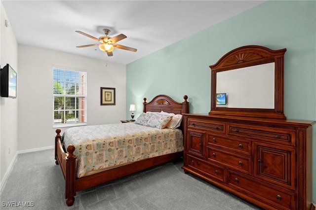 bedroom with carpet flooring, baseboards, and ceiling fan