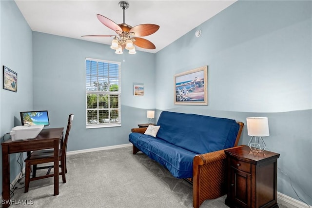 interior space with baseboards, carpet floors, and ceiling fan