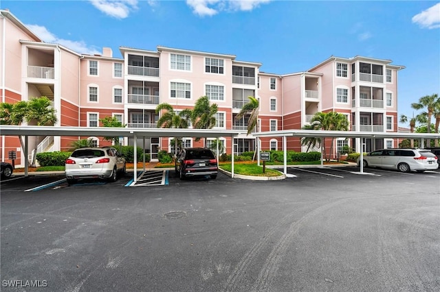 view of building exterior featuring covered parking