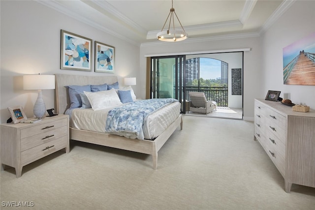 bedroom featuring light colored carpet, ornamental molding, a tray ceiling, and access to outside