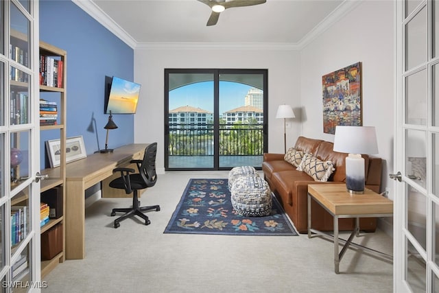 carpeted office space featuring ceiling fan, french doors, and ornamental molding