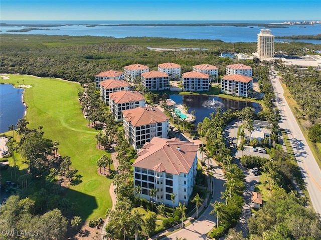 birds eye view of property featuring view of golf course and a water view