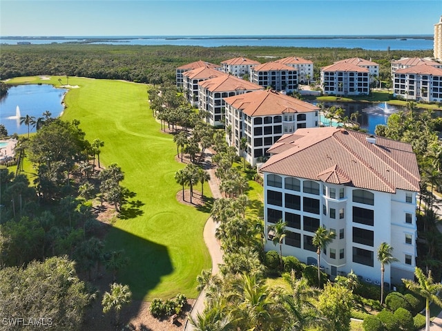 birds eye view of property featuring a water view and view of golf course