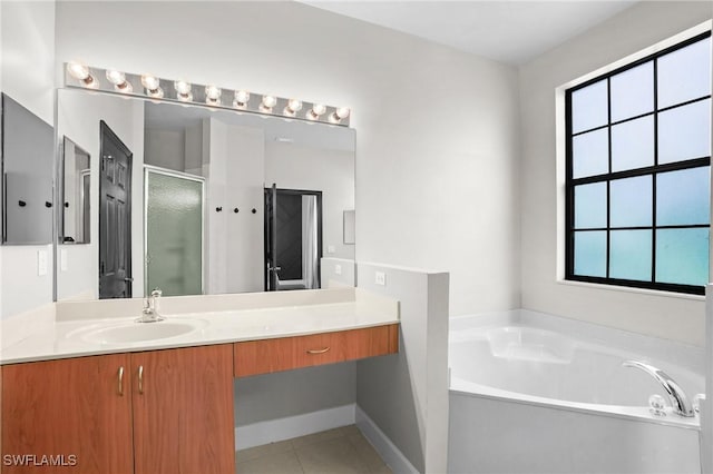 bathroom featuring a shower stall, tile patterned flooring, baseboards, a bath, and vanity