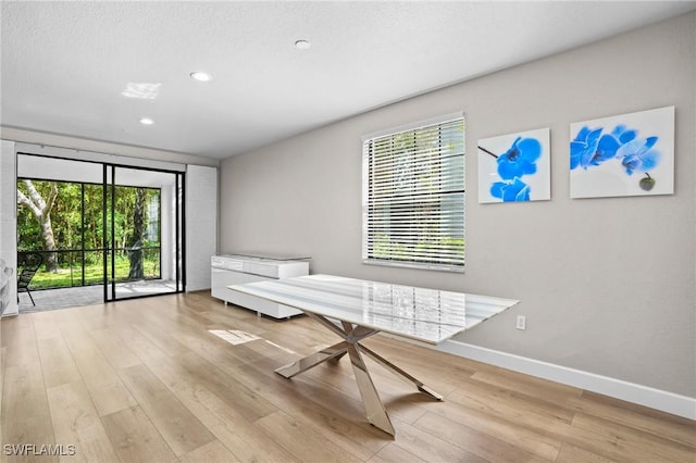 unfurnished room featuring recessed lighting, baseboards, and light wood-style flooring