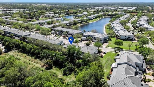 bird's eye view featuring a residential view and a water view