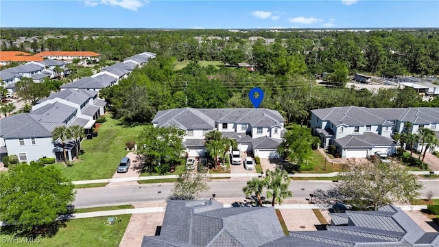 aerial view with a residential view and a view of trees