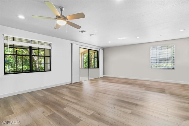 spare room featuring recessed lighting, visible vents, baseboards, and light wood-style flooring