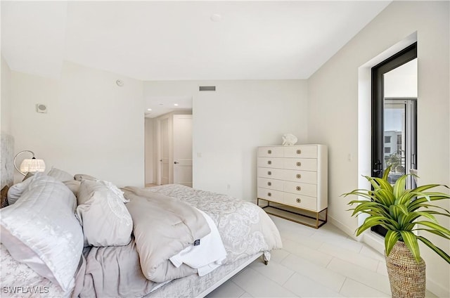 bedroom featuring visible vents and baseboards