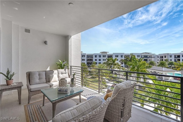 balcony with an outdoor hangout area and visible vents