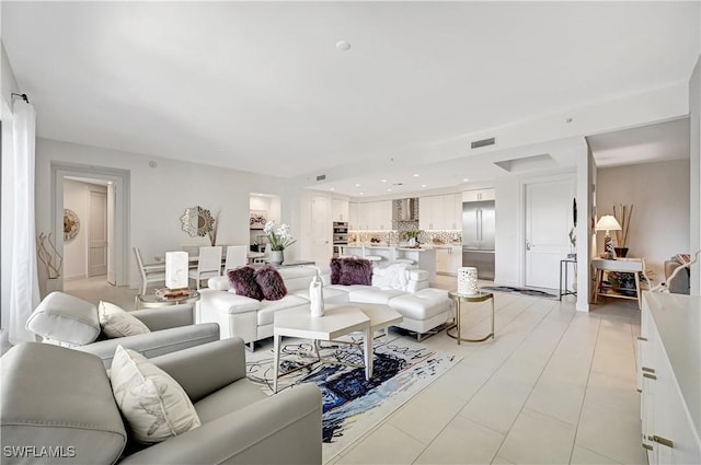 living room featuring visible vents and recessed lighting