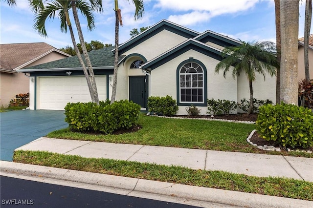 ranch-style house featuring an attached garage, concrete driveway, roof with shingles, stucco siding, and a front yard