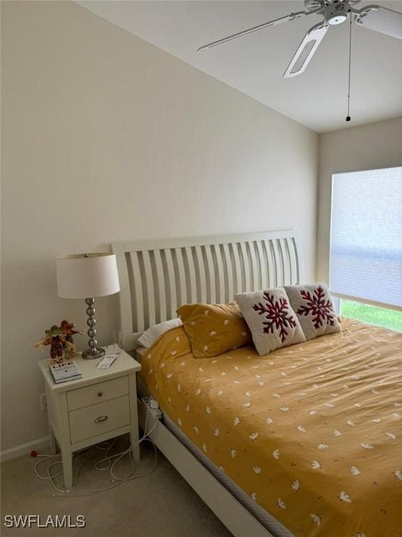 bedroom with light carpet and ceiling fan