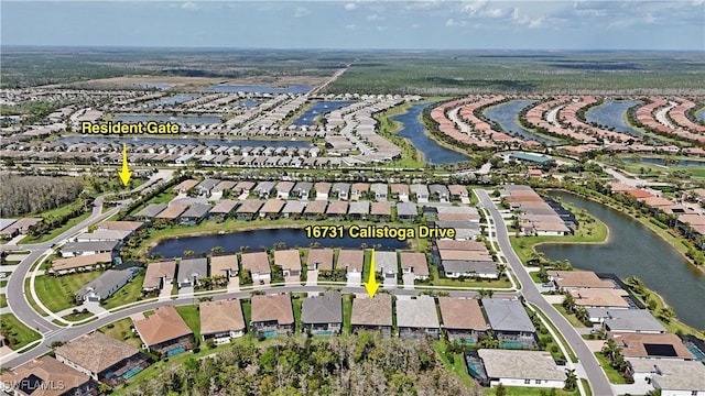 aerial view featuring a residential view and a water view